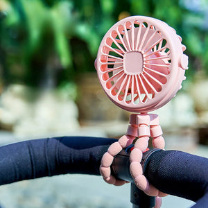 Portable clip-on stroller fan attached to baby stroller
